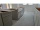 Kitchen island with farmhouse sink, grey cabinets at 3707 W San Juan St, Tampa, FL 33629