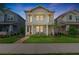 Charming two-story home boasting dual balconies, manicured lawn, and beautiful brick walkway at 13749 Rangeland Blvd, Odessa, FL 33556