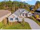 Luxury home with a large driveway and landscaped yard at 5018 Elm Leaf Dr, Brooksville, FL 34601