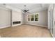 Light and airy bedroom with hardwood floors and a fireplace at 5018 Elm Leaf Dr, Brooksville, FL 34601