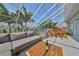 Spacious balcony with seating, firepit, and outdoor dining at 4334 Sanddollar Ct, New Port Richey, FL 34652