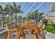 Covered balcony with outdoor dining and water views at 4334 Sanddollar Ct, New Port Richey, FL 34652