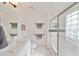 Clean bathroom with white vanity, shower, and tiled floor at 4334 Sanddollar Ct, New Port Richey, FL 34652