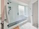 Spa-like bathroom with a large walk-in shower and hexagon tile floors at 4334 Sanddollar Ct, New Port Richey, FL 34652