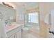 Clean bathroom with white vanity and a tub shower combo at 4334 Sanddollar Ct, New Port Richey, FL 34652