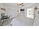 Bright bedroom with ceiling fan and private bathroom access at 4334 Sanddollar Ct, New Port Richey, FL 34652
