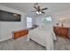 Spacious bedroom with a queen bed, TV, and ample floor space at 4334 Sanddollar Ct, New Port Richey, FL 34652