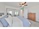 Main bedroom with sliding door closet and dresser at 4334 Sanddollar Ct, New Port Richey, FL 34652