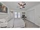 Spacious bedroom with a ceiling fan and private balcony access at 4334 Sanddollar Ct, New Port Richey, FL 34652