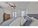 Main bedroom with private balcony access and dresser at 4334 Sanddollar Ct, New Port Richey, FL 34652