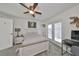Cozy bedroom with a ceiling fan and access to balcony at 4334 Sanddollar Ct, New Port Richey, FL 34652