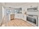 Updated kitchen, featuring stainless steel appliances and white shaker cabinets at 4334 Sanddollar Ct, New Port Richey, FL 34652