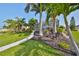Landscaped yard with walkway and seating area at 4334 Sanddollar Ct, New Port Richey, FL 34652