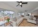 Spacious living area with sectional sofa, hardwood floors, and sliding glass doors to a deck at 4334 Sanddollar Ct, New Port Richey, FL 34652