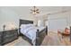 Spacious main bedroom with a large bed, ceiling fan, and plenty of natural light at 4334 Sanddollar Ct, New Port Richey, FL 34652