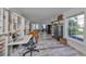 Home office with built-in shelving, desk, and large window at 4334 Sanddollar Ct, New Port Richey, FL 34652