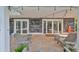 Outdoor patio with seating and a large TV at 4334 Sanddollar Ct, New Port Richey, FL 34652
