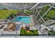 Elevated pool deck with outdoor kitchen and spiral stairs at 4334 Sanddollar Ct, New Port Richey, FL 34652