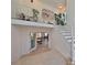 Modern staircase with white railings, leading to an open loft area; view of a home office at 4334 Sanddollar Ct, New Port Richey, FL 34652