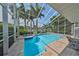 Inviting swimming pool with spa and screened enclosure at 4334 Sanddollar Ct, New Port Richey, FL 34652