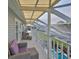 Covered balcony with seating area, offering tranquil views at 4334 Sanddollar Ct, New Port Richey, FL 34652