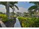 Walkway leading to waterfront with lush landscaping at 4334 Sanddollar Ct, New Port Richey, FL 34652