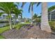 Landscaped waterfront view with seating area at 4334 Sanddollar Ct, New Port Richey, FL 34652