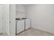 Bright laundry room with washer, dryer, and shelving at 12733 Wanderlust Pl, Parrish, FL 34219