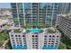 High-rise building with rooftop pool and city views at 777 N Ashley Dr # 1516, Tampa, FL 33602