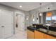 Modern kitchen with light wood cabinets and a granite countertop at 777 N Ashley Dr # 1516, Tampa, FL 33602