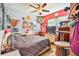 Bedroom with eclectic decor and a cat tree at 10031 Geese Trail Cir, Sun City Center, FL 33573