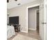 Bedroom with wood-look floors and access to hallway at 6921 Onyx N Dr, St Petersburg, FL 33702