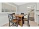 Kitchen dining area with wood table and four chairs at 6921 Onyx N Dr, St Petersburg, FL 33702