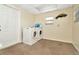 Laundry room with washer, dryer, and exterior access at 6921 Onyx N Dr, St Petersburg, FL 33702