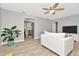 Living room with white couch and view into kitchen at 6921 Onyx N Dr, St Petersburg, FL 33702