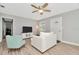 Living room with white couch, mint chair and wood flooring at 6921 Onyx N Dr, St Petersburg, FL 33702