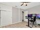 Home office with wood-look floors, built-in closet, and dual monitors at 6921 Onyx N Dr, St Petersburg, FL 33702