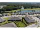 Aerial view of community with homes and golf course at 3778 Maxwell Park Dr, Sun City Center, FL 33573