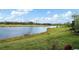 Peaceful backyard oasis overlooking a serene lake and golf course at 3778 Maxwell Park Dr, Sun City Center, FL 33573