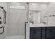 Modern bathroom with double vanity and walk-in shower at 3778 Maxwell Park Dr, Sun City Center, FL 33573