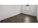 Simple bedroom with hardwood floors and a window at 3778 Maxwell Park Dr, Sun City Center, FL 33573