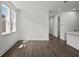 Spacious living room with hardwood floors and large windows at 3778 Maxwell Park Dr, Sun City Center, FL 33573