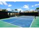 Well-maintained pickleball court with seating area at 3778 Maxwell Park Dr, Sun City Center, FL 33573