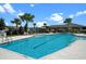 Community pool with lounge chairs and gazebo at 3778 Maxwell Park Dr, Sun City Center, FL 33573
