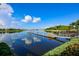 Calm lake with dock and paddle boats at 5239 Admiral Pointe Dr, Apollo Beach, FL 33572