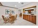 Casual dining area with wicker chairs and glass-top table at 20 Summerwinds Ln, Oldsmar, FL 34677