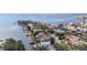 Panoramic aerial view of a waterfront community with a bridge and Tampa Bay in the distance at 5006 W San Miguel St, Tampa, FL 33629