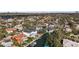 Aerial view of a neighborhood with waterfront homes and a canal leading to Tampa Bay at 5006 W San Miguel St, Tampa, FL 33629