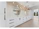 Modern bathroom featuring a double vanity, stylish lighting, and elegant finishes at 5006 W San Miguel St, Tampa, FL 33629