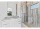 Modern bathroom boasts tile shower, contemporary vanity, and a window with a view at 5006 W San Miguel St, Tampa, FL 33629
